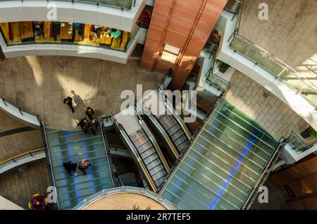 Belfast, County Antrim, Northern Ireland February 24 2023 - Shopping centre viewed from the top floor showing walkways and escalator Stock Photo