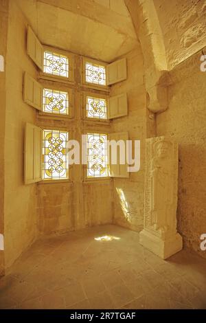 Interior with stained glass window and figure, Romanesque Cloitre St-Trophime, Saint, monastery, monastic church, Romanesque, Arles Stock Photo