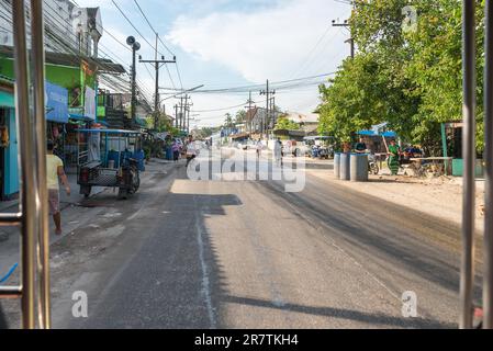 Shops, stores, locals on the main road to the Ranong Pier where the ferry goes to Ko Chang and Ko Phayam Stock Photo