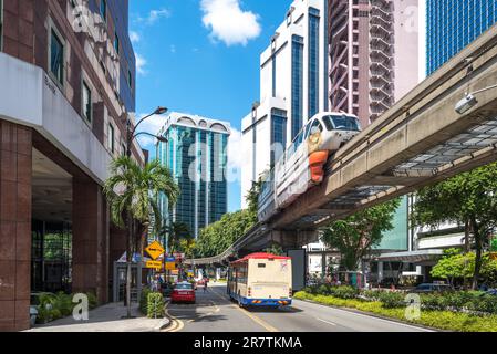 Streetscape of traffic, bridge and train in the Bukit Bintang district of Kuala Lumpur. The trains of the KL Monorail Line connects several stations Stock Photo