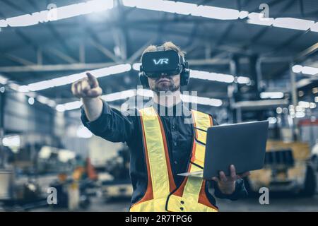 Engineer male using VR virtual reality technology in modern warehouse factory new innovation engineering Stock Photo