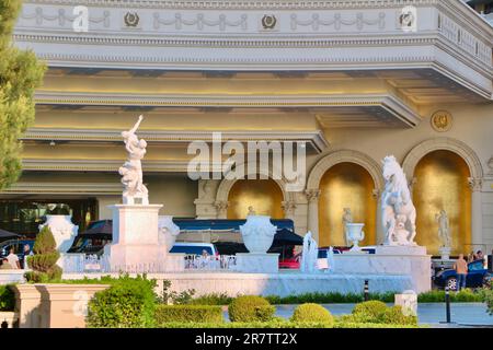 The forecourt entrance to Caesars Palace hotel and casino with vehicles picking up and dropping people off Las Vegas Strip Las Vegas Nevada USA Stock Photo