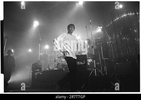 MANI, THE STONE ROSES, BASSIST, 1994: Mani (Gary Mounfield) the bassist of The Stone Roses playing at Newport Centre in Newport, Wales, UK on a tour to promote their 'Love Spreads' single and 'Second Coming' album, 4 December 1994. Photo: Rob Watkins Stock Photo