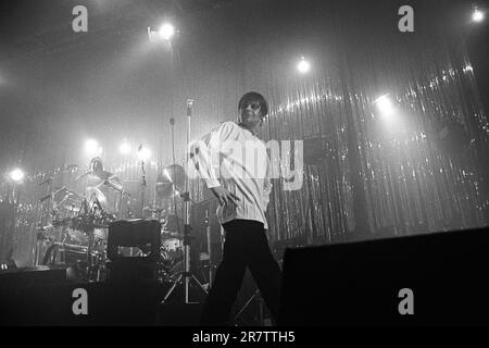 MANI, THE STONE ROSES, BASSIST, 1994: Mani (Gary Mounfield) the bassist of The Stone Roses playing at Newport Centre in Newport, Wales, UK on a tour to promote their 'Love Spreads' single and 'Second Coming' album, 4 December 1994. Photo: Rob Watkins Stock Photo