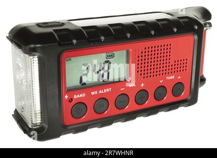Weather radio ideal for natural disasters with its rechargeable bettery, solar panel, hand crank and flashlight in a portable unit Stock Photo