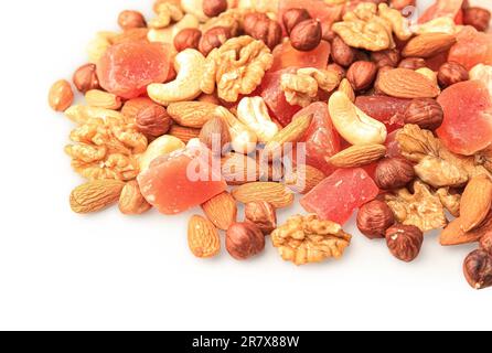 Different tasty nuts and dried papayas on beige background, space for text Stock Photo
