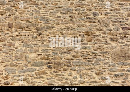 Background of stone wall texture. Close up of stone wall texture. Stock Photo