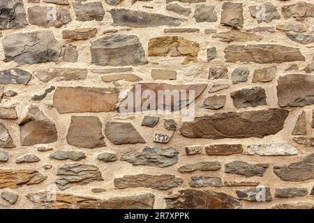 Background of stone wall texture. Old stone wall texture for design. Stock Photo