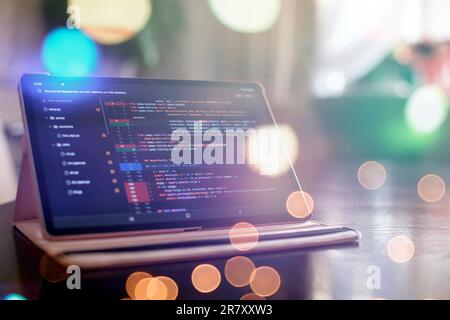 Notebook closeup photo. CSS, JavaScript and HTML usage. Monitor closeup of function source code. Abstract IT technology background. Stock Photo