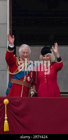 London, UK 17 June 2023. After Trooping the Colour (The King’s Birthday Parade) takes place senior members of the Royal Family watch the traditional flypast by the RAF from the balcony at Buckingham Palace. HRH King Charles III and Queen Camilla wave to the crowds ouside Buckingham Palace Stock Photo