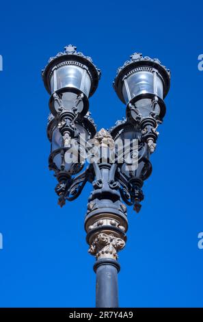 close up shot of old wrought iron street lamp, with four lamps Stock Photo