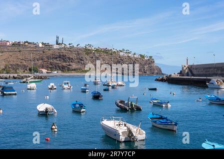 Fishing boats in the harbor of the tourist destination Playa de Santiago on the canary island La Gomera. The village is situated in the south of the Stock Photo