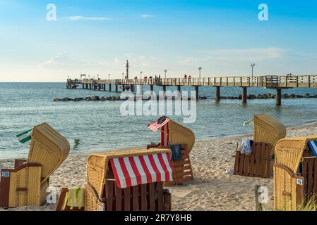 Pier at the northeastern seaside resort Wustrow at the baltic sea in Germany. The popular village on the Darss, Fish Land, with the white sandy beach Stock Photo