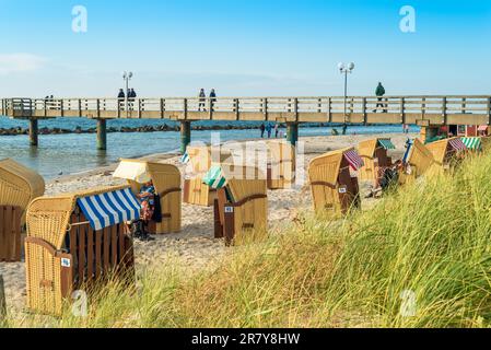 Pier at the northeastern seaside resort Wustrow at the baltic sea in Germany. The popular village on the Darss, Fish Land, with the white sandy beach Stock Photo
