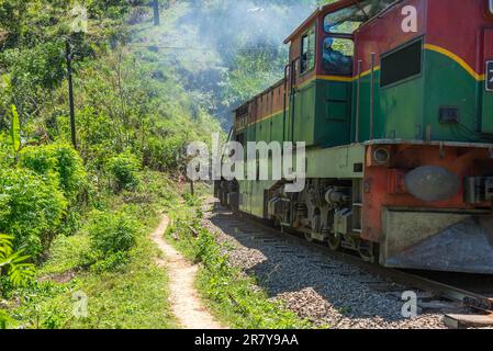 Shortly behind the nine arches bridge between Demodara and Ella, the track leads through a tunnel. The locomotive is on the way to Ella, in the Stock Photo