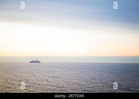 The ferry sails at dawn. Very beautiful sky Stock Photo