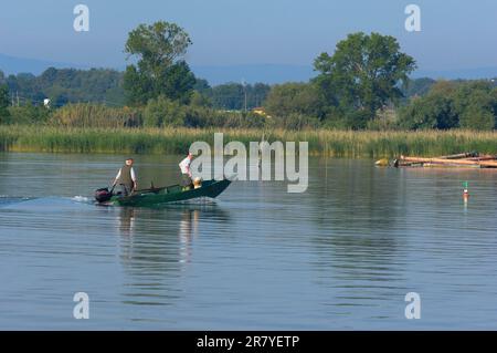 Castiglione del Lago, fisherman, Lago Trasimeno, Lake Trasimeno, Province of Perugia, Umbria, Italy Stock Photo