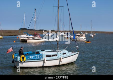 Jupiter yacht motoring into Wells Town harbour Stock Photo