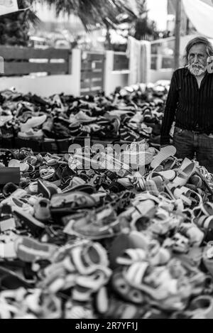 Shoe sale on the farmers market in the village Tymbaki in south-central of Crete. The street markets are traditional at the weekend in the streets of Stock Photo