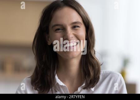 Closeup headshot portrait of happy young woman Stock Photo