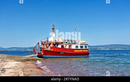 Cromarty Scotland Nigg - Cromarty Ferry the red Renfrew Rose in early summer waiting at the Cromarty slipway Stock Photo
