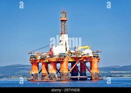 Cromarty Town Scotland  large decommissioned orange oil rig Transocean Leader in early summer Stock Photo