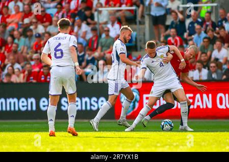 Oslo, Norway, 17th June 2023. Scotland's Scott McTominay and Norway's Erling Braut Haaland battles for the ball in the UEFA Euro 2024 qualifier between Norway and Scotland at Ullevål Stadium in Oslo   Credit: Frode Arnesen/Alamy Live News Stock Photo