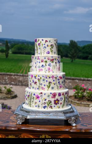Four tier wedding cake with pressed flowers Stock Photo