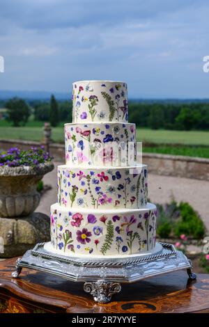 Four tier wedding cake with pressed flowers Stock Photo