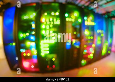 Blurred abstract background of bokeh server lamps. AI intelligence system in the server room is constantly evolving. Stock Photo