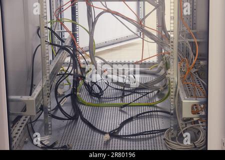 The computer network connection relies heavily on properly installed cables. With so many wires and cables, it's easy to get lost in the web of connec Stock Photo