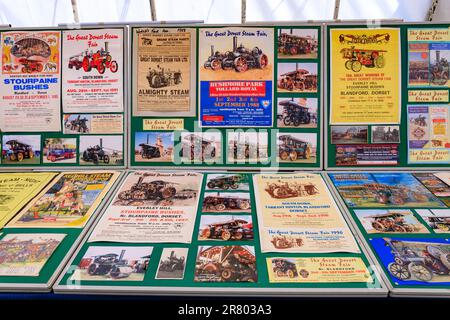 A display of vintage posters for steam and traction engine rallies at the Abbey Hill Steam Rally, Yeovil, Somerset, England, UK Stock Photo