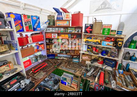 A colourful collection of tools, tins and equipment from a vintage garage displayed at Abbey Hill Steam Rally, Yeovil, Somerset, England, UK Stock Photo