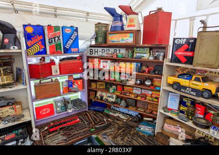 A colourful collection of tools, tins and equipment from a vintage garage displayed at Abbey Hill Steam Rally, Yeovil, Somerset, England, UK Stock Photo