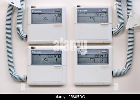 Wall-mounted control panel for a group of industrial air conditioners Daikin Stock Photo