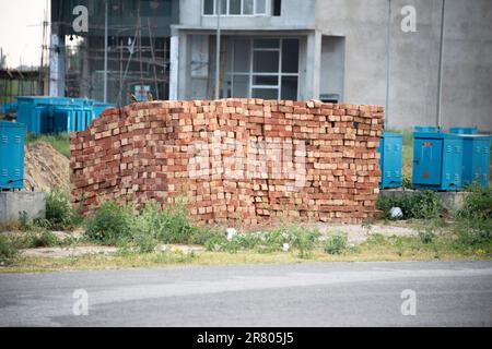 stack of red bricks on the construction site Stock Photo