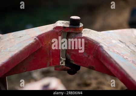 A closeup view of the coupling on a disc harrow for cultivating land Stock Photo