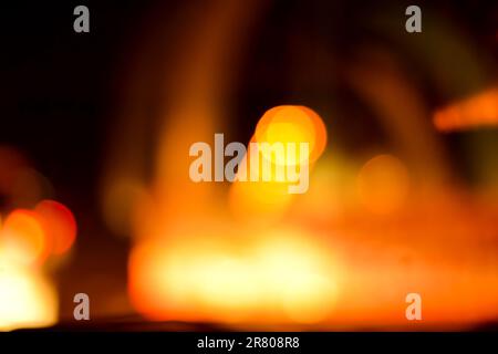 Blurred defocused lights at night. Abstract blur vehicle coming at night in the city. Stock Photo