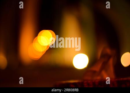 Blurred defocused lights at night. Abstract blur vehicle coming at night in the city. Stock Photo