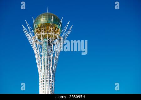 Astana, Kazakhstan - April 2, 2023: Top part of Baiterek tower in Astana (Nur-Sultan) close-up with space for text Stock Photo