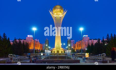 Astana , Kazakhstan - April 4, 2023: The Baiterek tower and Nurjol Boulevardin Astana city (former Nur-Sultan) at dusk Stock Photo