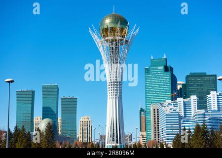 Astana (Nur-Sultan), Kazakhstan - April 4, 2023: Buildings of Astana city and Baiterek tower Stock Photo