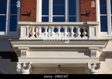 A view of a richly decorated balcony in a historic building maintained in the Neo-Gothic style. Stock Photo