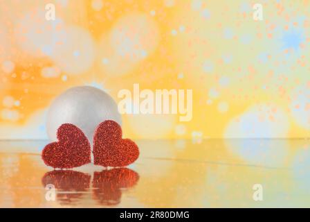 Two beautiful romantic vintage red hearts together on a beautiful snow winter background Stock Photo