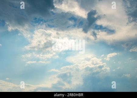 Scattered cloud clusters in a blue sky, blue sky background with white clouds. Stock Photo