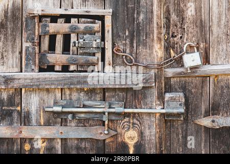 Wintage door locks on wooden rustic door Stock Photo