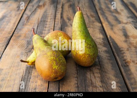Delicious juicy pears on a rustic natural wooden table Stock Photo