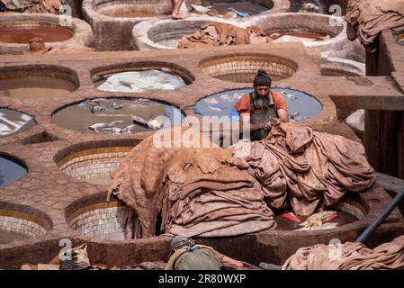 FES, MOROCCO - ARIL 10, 2023 - Famous tannery in the medina of Fes, where leather is being processed for generations, Morocco Stock Photo