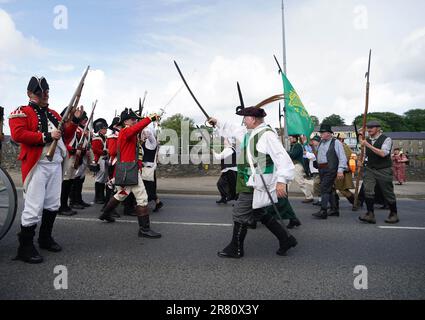 Re-enactors recreate the battle of Enniscorthy Bridge in Enniscorthy, Co Wexford to mark the 225th anniversary of the 1798 rebellion between the United Irish men and the forces of the Crown. Picture date: Sunday June 18, 2023. Stock Photo