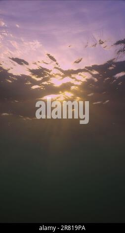 Red Sea, Egypt. 17th June, 2023. Evening sunlight creates beautiful veil, consisting of sunlight at sunset. Underwater ocean waves oscillate and flow with rays of light at sundown, Red sea, Egypt (Credit Image: © Andrey Nekrasov/ZUMA Press Wire) EDITORIAL USAGE ONLY! Not for Commercial USAGE! Stock Photo